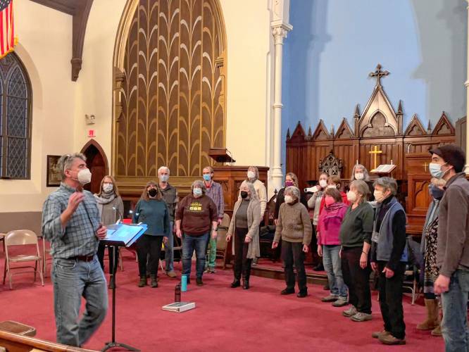 Music Director Joe Toritto, at left, leads the Eventide Singers during a rehearsal at the Second Congregational Church of Greenfield.