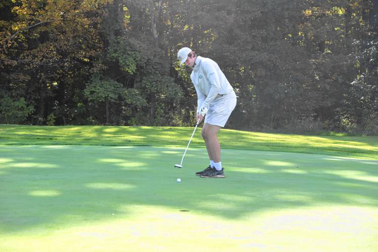 Greenfield’s Michael Pierce putts on Hole No. 2 during a match against Athol at the Country Club of Greenfield on Wednesday. 