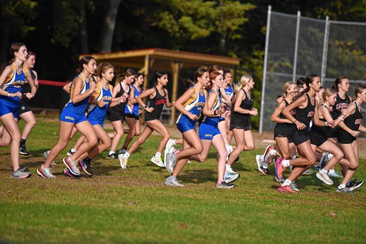 Runners take off from the start during the girls race in Orange on Tuesday.