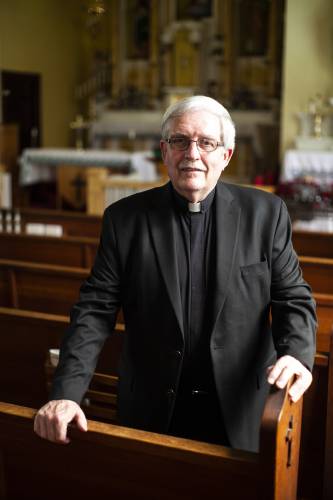 Rev. Robert Koerber stands in the Holy Name of Jesus Church at 15 Thayer St. in South Deerfield.