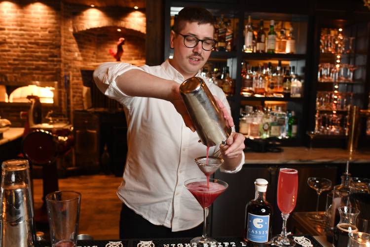 Ethan Bray, at The Farm Table in Bernardston, makes a Bogger’s Delight with cranberry-infused vodka.