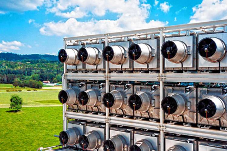 At this commercial direct air capture plant in Hinwil, Switzerland, fans draw in air and chemicals help bind the carbon dioxide so it can be stored underground.