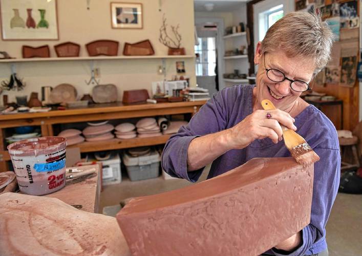 Shelburne Falls potter Mary Barringer, seen here in her studio, is one of the eight host artists for this year’s Asparagus Valley Pottery Trail April 27-28. She’s hosting three guest artists, including two from Minnesota.