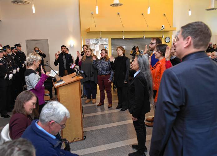 In her first act as new mayor, Virginia “Ginny” Desorgher swears in city officials at the John Zon Community Center Tuesday morning.