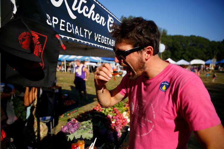 Nicholas Kimberly samples various salsas made by Kitchen Garden Farms during the 19th North Quabbin Garlic and Arts Festival in 2017 in Orange.