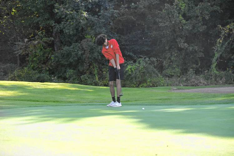 Athol’s Rafeal Lopez putts on Hole No. 2 during a match against Greenfield at the Country Club of Greenfield on Wednesday.