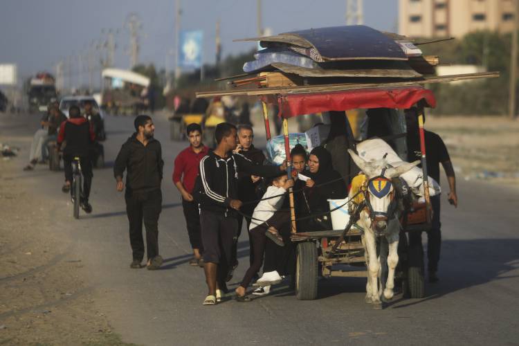 Palestinians flee the Israeli ground offensive in Khan Younis, Gaza Strip, on Wednesday.