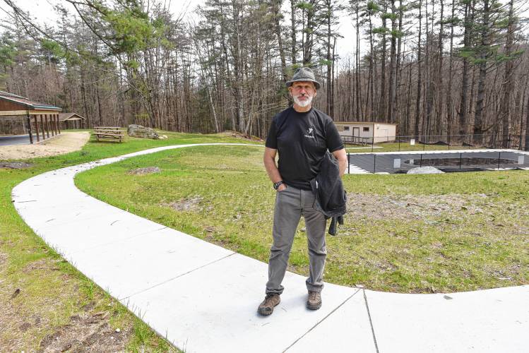 Franklin County’s YMCA CEO Grady Vigneau stands on a newly poured walkway to the new pool at Camp Apex in Shelburne. Thanks to $427,000 in congressionally directed spending, Camp Apex will continue a string of ongoing facilities upgrades.