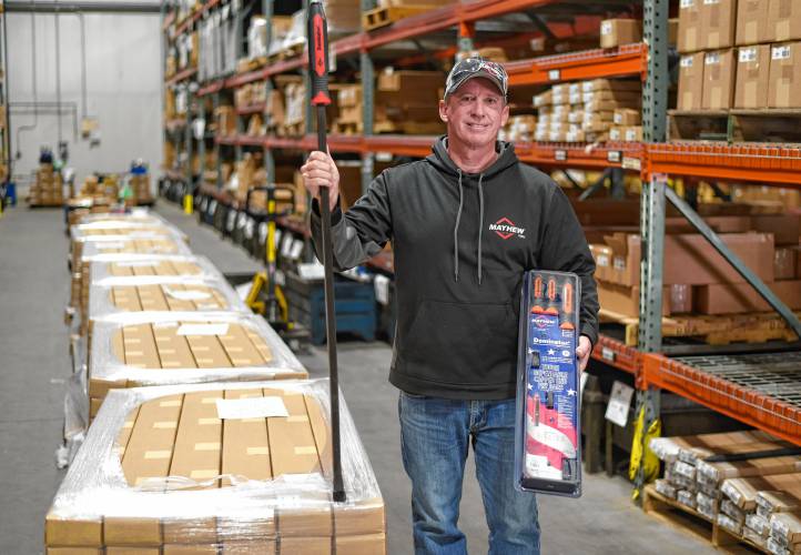 Co-owner Bill Lawless with pry bars in the warehouse area at Mayhew Tools in the Airport Industrial Park in Turners Falls. 