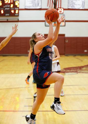 Frontier’s Claire Kirkendall (11) puts in a breakaway layup against Easthampton in the second quarter Thursday night in Easthampton.