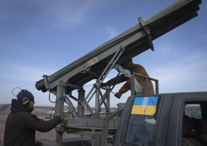 Ukrainian soldiers from The 56th Separate Motorized Infantry Mariupol Brigade prepare to fire a multiple launch rocket system based on a pickup truck towards Russian positions at the front line, near Bakhmut, Donetsk region, Ukraine, Tuesday, March 5, 2024.