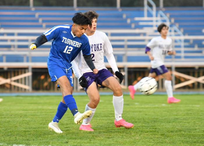 Turners Falls’ Yolvin Ovalle-Mejia shoots past Holyoke defender Arhur Mazzu at the Bourdeau Fields Complex in Turners Falls on Tuesday evening. 