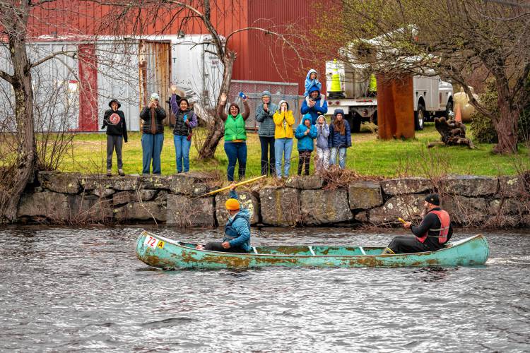 Spectators by the finish line cheer for Brad Teeter and Michael Del Rio during the 59th running of the River Rat Race from Athol to Orange on Saturday.