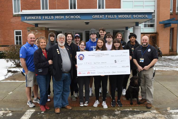Members of the Montague Elks Lodge, Turners Falls High School Athletic Leadership Council and representatives of the Helping Hands charity pose with a $2,500 donation from the Elks at Turners Falls High School on Monday.